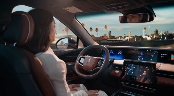 A person is shown driving hands-free on the highway with available Lincoln BlueCruise technology. | Pines Lincoln in Pembroke Pines FL