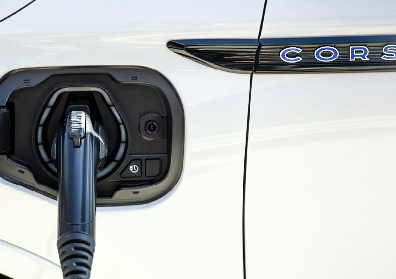 A charging cord is shown connected to a Lincoln Corsair Grand Touring
