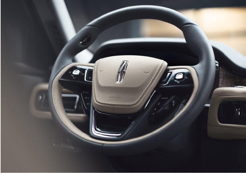 The intuitively placed controls of the steering wheel on a 2023 Lincoln Aviator® SUV | Pines Lincoln in Pembroke Pines FL